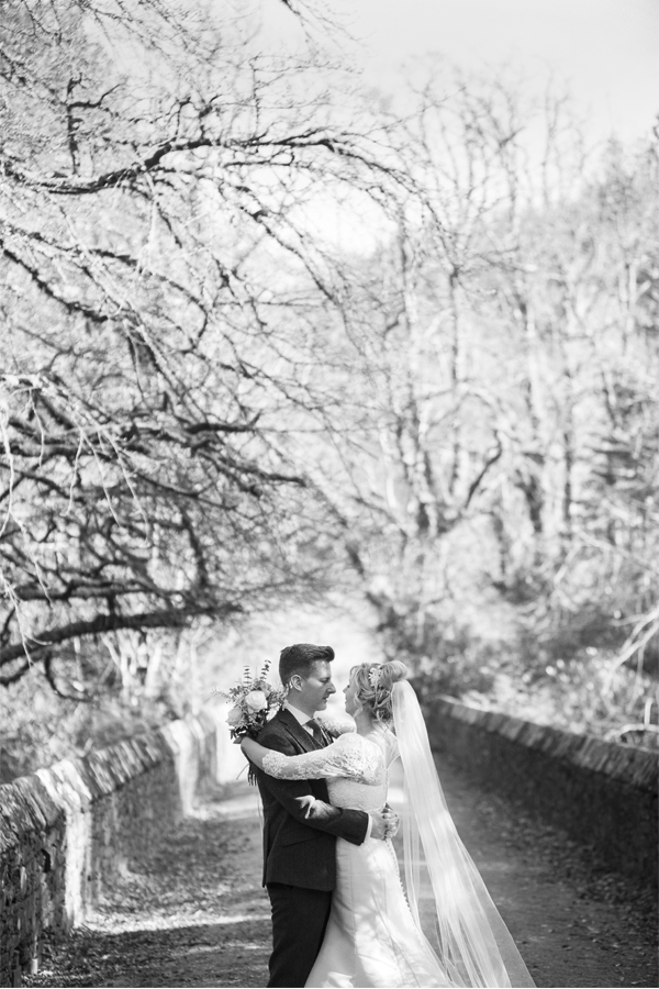  stonefield castle wedding photos bride and groom on a bridge 
