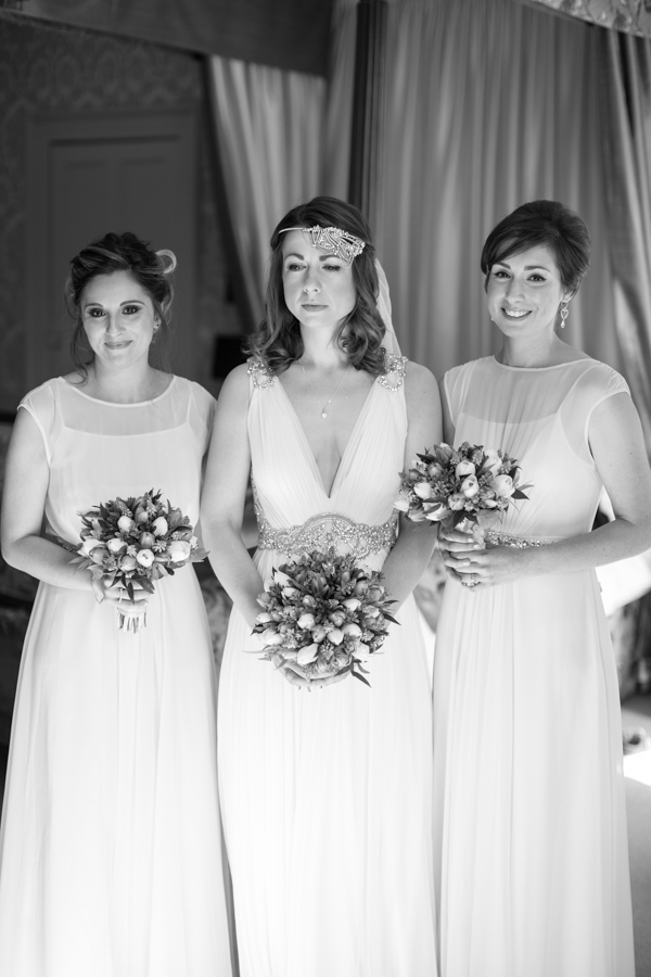 bride and bridesmates holding flowers