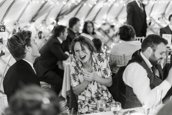 guests laughing at speeches 