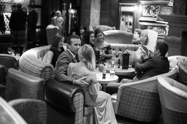 guests relaxing at cameron house hotel bar