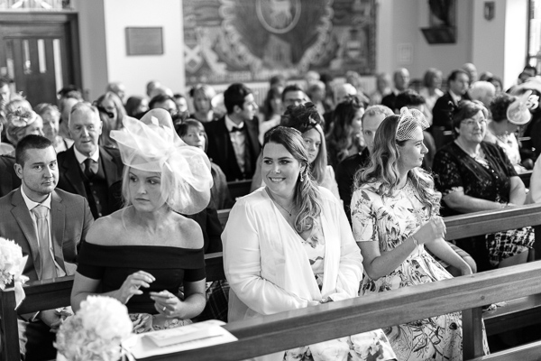 guests waiting for bride to arrive at the church in  bearsden scotland 