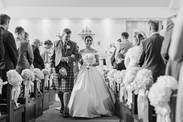 newlyweds walking down the aisle wedding photographer glasgow