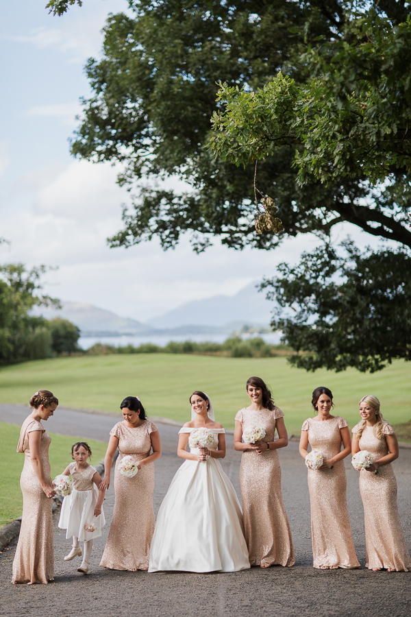 bride with bridesmates with a view over loch lomond