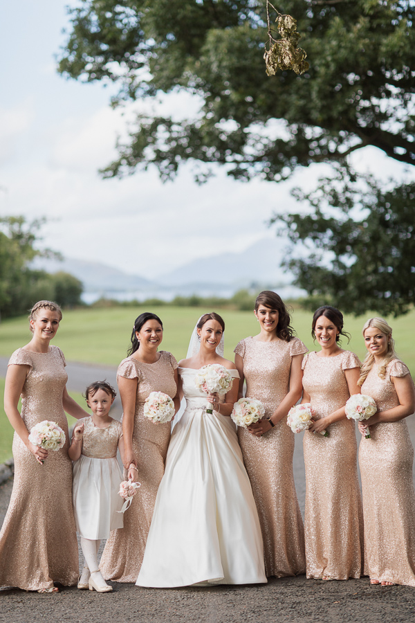 bride with bridesmates and flower girl