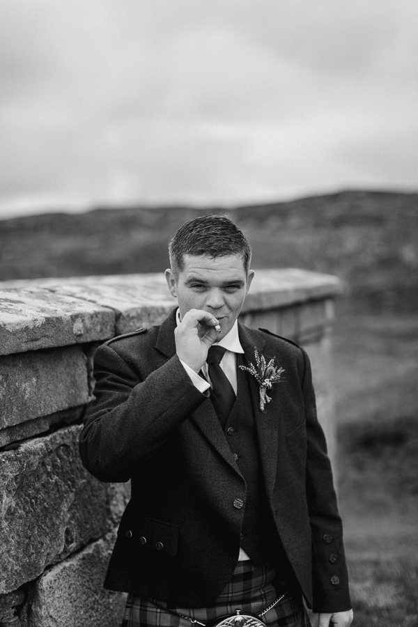 groom smoking after the ceremony