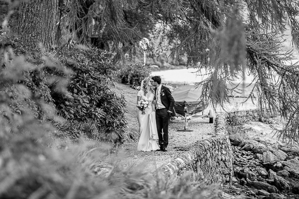 newlyweds walking down a path together