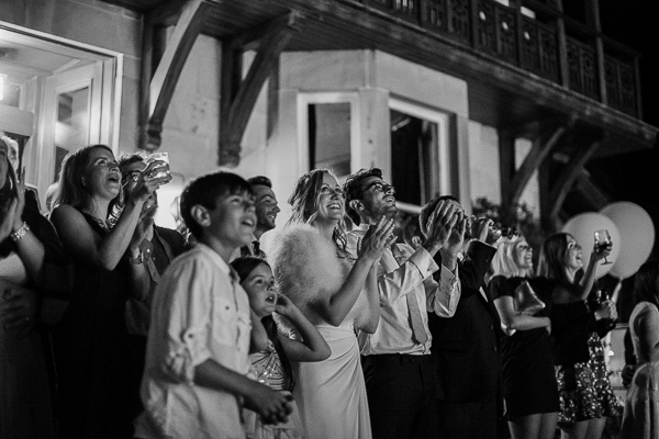 wedding guests clapping after fireworks display