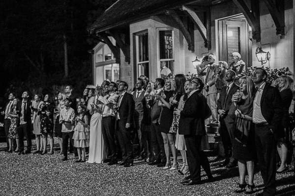 wedding guests watching fireworks