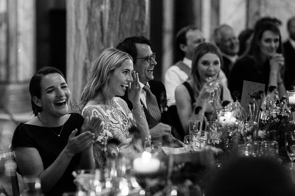 bridal party laughing at speeches