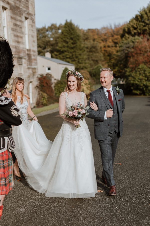 birde and her father walking do the aisle at glenapp castle